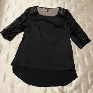 BCBGMaxazria black silky top in size medium with lace and open back!